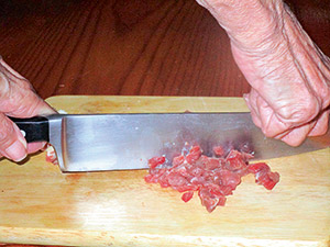 Chopping meat by hand — the single-knife method